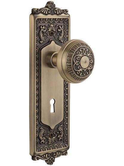 Egg and Dart Door Set with Matching Knobs and Keyhole Single Dummy in Antique Brass.
